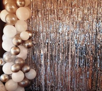 Decoration with foil curtain and balloon