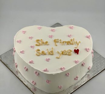 Romantic Heart-Shaped Engagement Cake – Custom “She Said Yes” Design